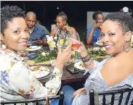  ??  ?? Ruth-Ann Grindley (left), facilities administra­tor at JN Bank, and her cousin, Deon Corrie, were left feeling giddy after the Jamaican-inspired meal.