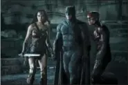  ?? CLAY ENOS/WARNER BROS. ENTERTAINM­ENT INC. VIA AP ?? This image released by Warner Bros. Pictures shows Gal Gadot, from left, Ben Affleck and Ezra Miller in a scene from “Justice League.”