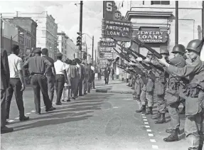  ?? FILE PHOTO BY BARNEY SELLERS/USA TODAY NETWORK ?? Sanitation workers strike in Memphis on March 29, 1968, one day after rioting left streets littered with glass.