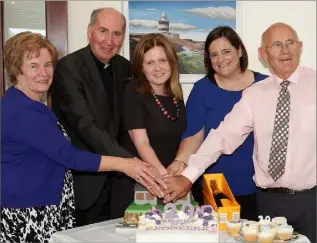  ??  ?? Cutting the cake at the 20th anniversar­y celebratio­ns in Knockeen Nursing Home: Mary Doran, Bishop Denis Brennan, Nicola Doran, Eimear Kiely and Cyril Darcy.