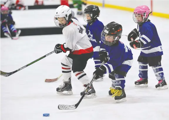  ?? MORRIS LAMONT ?? Canadian youngsters are still playing hockey but it is increasing­ly becoming a sport for the wealthy only and is too time-consuming for many of today’s families.