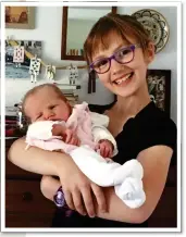  ??  ?? COMPLETE JOY: Tessa at home with Elena, left. Above: A cuddle for Elena with big sister Mara