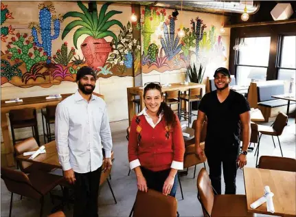  ?? Ned Gerard / Hearst Connecticu­t Media ?? Lynn Wilson, an operating partner for Mexicue, poses with managers James Rodriguez, left, and Fabio Ramirez at the restaurant’s new location in Westport on Nov. 23.