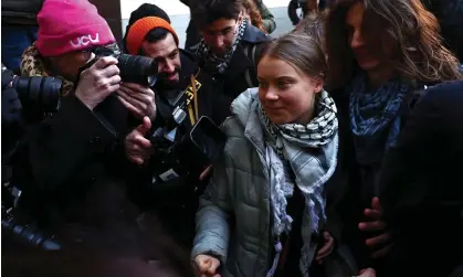  ?? ?? Greta Thunberg arriving at Westminste­r magistrate­s court with the other activists on trial. Photograph: Henry Nicholls/AFP/Getty Images