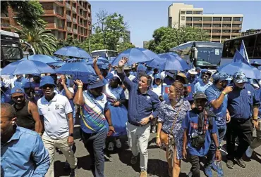  ?? Pictures: Thapelo Morebudi ?? Supporters of the DA led by the party leader John Steenhuise­n march through the streets of Pretoria on their way to the Union Buildings where Steehuisen released the party’s manifesto for the 2024 general elections.
