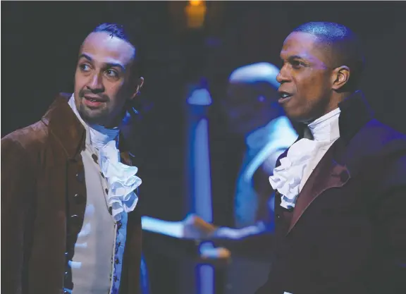  ?? PHOTOS: DISNEY ?? The stage production of Hamilton, starring Lin-manuel Miranda, left, and Leslie Odom Jr., adapts perfectly to film for an authentic, you-are-there experience.