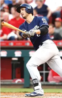  ?? | DYLAN BUELL/ GETTY IMAGES ( LEFT), JOHN MINCHILLO/ AP ?? Eric Thames ( left) is benefittin­g at the plate because pitchers arewary of Ryan Braun.