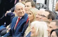  ?? MENAHEM KAHANA/AFP/GETTY IMAGES ?? Israel's Prime Minister Benjamin Netanyahu, left, White House adviser Jared Kushner and Ivanka Trump attend the opening.