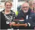  ??  ?? Maldon mayor Jeanette Stilts presents the PBO Miles to Maldon trophy to Gerwyn Lewis