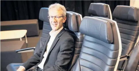  ?? Photo / Jason Oxenham ?? Air New Zealand head of aircraft programmes, Kerry Reeves, checks out the new A321neo’s seats, which are upholstere­d with leather from Taranaki.