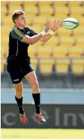  ??  ?? Beauden Barrett, his boots fitted with rainbow-coloured laces, leaps into action at a Hurricanes training session yesterday.