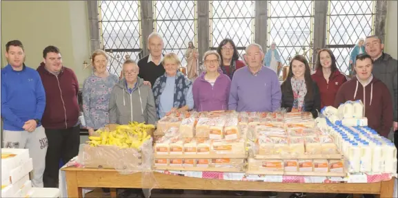  ??  ?? A group of volunteers at St. Patrick’s Sacristy who gave out food parcels on Friday morning.