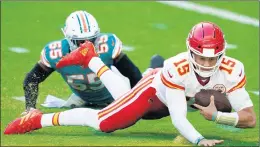  ?? MARK BROWN/GETTY ?? Dolphins linebacker­Jerome Baker sacks Patrick Mahomes for a 30-yard loss.