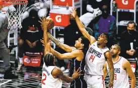  ?? Ringo H.W. Chiu / Associated Press ?? Magic forward Chuma Okeke led Orlando with 18 points during a 10396 win at Staples Center.