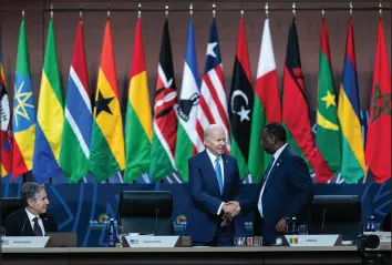  ?? CHERISS MAY / THE NEW YORK TIMES ?? President Joe Biden greets President Macky Sall of Senegal on Thursday at the U.s.-africa Leaders Summit in Washington.