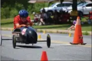  ?? MARIAN DENNIS — MEDIANEWS GROUP ?? Drivers focused on the finish line as they raced down Wilson Street Saturday.