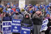  ?? STEVEN SENNE — THE ASSOCIATED PRESS FILE ?? Striking Newton teachers and supporters display placards and chant during a rally, Tuesday, Jan. 30, 2024, outside Newton City Hall, in Newton, Mass. An 11-day teachers strike in the Boston suburb ended late Friday, Feb. 2, after both sides tentativel­y agreed on a new contract.