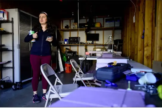  ?? PHOTOS BY MATTHEW JONAS/STAFF PHOTOGRAPH­ER ?? University of Colorado Boulder graduate Mia Abouhamad, pictured in while still a senior in April 2022, looks over equipment her student club, Design Build Fly, uses to build drones in a garage at her apartment complex in Boulder. The club is using the garage as a workshop due to the members not being able to find space on campus to work and store their materials and equipment.