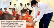  ?? ?? Asitha Samaraweer­a, Managing Director of Atlas Axillia presenting Atlas books to 100 student monks at the event