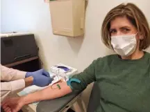  ?? AFP PHOTO / DIANA BERRENT ?? PATIENT APPROACH: Diana Berrent, a New Yorker who has recovered from COVID-19, gets blood drawn. For patients who’ve emerged from quarantine after recovering, donating antibodies could be a key way to build immunity across a broader range of the population.