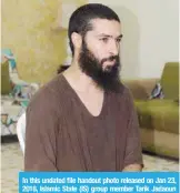  ??  ?? In this undated file handout photo released on Jan 23, 2018, Islamic State (IS) group member Tarik Jadaoun sits inside a room at an unknown location. — AFP