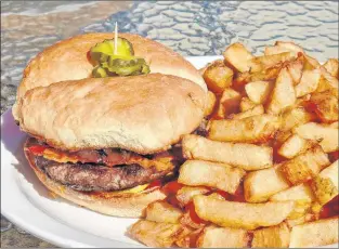  ?? Karl Wells photos ?? Landings’ burger and fries.