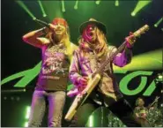  ?? ASSOCIATED PRESS FILE ?? Bret Michaels, left, and C.C. DeVille of the band Poison perform in concert at the Royal Farms Arena in Baltimore in 2017. They’re back on the road this year, with opener Cheap Trick.