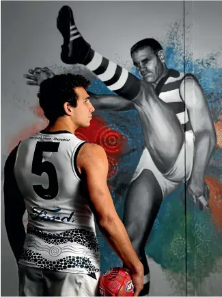  ?? GETTY IMAGES ?? Nakia Cockatoo of the Geelong Cats poses in front of a mural of club great ‘‘Polly’’ Farmer at Galleria in Melbourne last year.