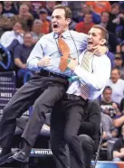  ?? ALONZO ADAMS/USA TODAY SPORTS ?? Oklahoma State wrestling coach John Smith, left, and his Cowboys will get a remodeled locker room thanks to a $1 million gift from an anonymous donor.