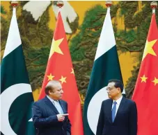  ?? AFP ?? China’s Premier Li Keqiang (R) and Pakistan’s Prime Minister Nawaz Sharif attend a signing ceremony at the Great Hall of the People in Beijing on Saturday. —