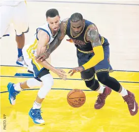  ??  ?? The Warriors’ Stephen Curry, left, and the Cavaliers’ LeBron James.