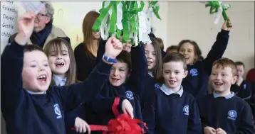  ??  ?? Second class cheer on Ms Loftus and her rugby fanaticism.