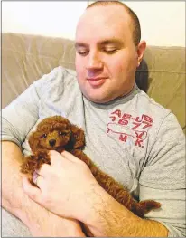  ?? SUBMITTED PHOTO/ALEX EUBANKS ?? Dog sitter Alex Eubanks holds a toy poodle named Dallas. Eubanks has been offering the Rover.com service for two years.