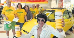  ??  ?? ●●Elvis aka Ken Downs leads the way with (from left) Gerry Sullivan, Debbie Johnson, Alice McKeegan, Pat Harding and Ian Jenkins at Rochdale Exchange Shopping Centre’s Yellow Day event