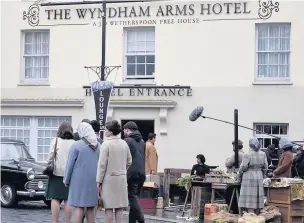  ?? BOB PHILLIPS ?? Above and below, Bridgend town centre was transforme­d into Dublin in the 1970s by the BBC for the filming of Hugh Grant’s new series A Very English Scandal