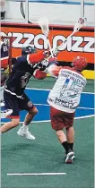  ?? ANNA TAYLOR SPECIAL TO THE EXAMINER ?? New Peterborou­gh Laker Corey Small shoots on Nick Rose of the Oakville Rock on Monday in their Major Series Lacrosse opener. Oakville won 8-7.