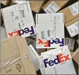  ??  ?? PILING UP: FedEx adds its own charges to Customs’ fees for items sent from abroad