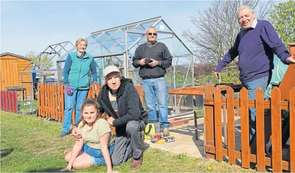  ??  ?? Back, from left, Edna, Gordon McLellan, and chairman of the allotments Tony Hayes. Front, Joe Mitchell with grand daughter Maddison, 8.