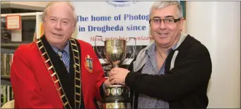  ??  ?? Mayor Godfrey presents Pat Burke with the Intermedia­te trophy.