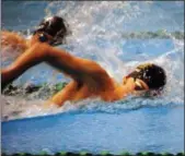  ?? JON BEHM — THE MORNING JOURNAL ?? Amherst senior Nathan Moore stays in front of Medina junior Austin Olsavsky during the 200 freestyle at the Division I Lakewood Sectional meet at Cleveland State’s Robert F. Busbey Natatorium on Feb. 10.