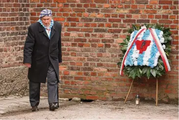  ?? Michal Dyjuk/Associated Press ?? Stanislaw Zalewski attends a wreath-laying ceremony in the former Nazi concentrat­ion camp Auschwitz in Poland on Jan. 27, 2023.