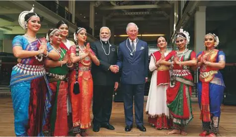  ?? PTI ?? Britain’s Prince Charles and India’s Prime Minister Modi with Indian dancers during a visit to the Science Museum in London yesterday. Modi is in London to attend the Commonweal­th Heads of Government Meeting (CHOGM). Britain is seeking to bolster its...