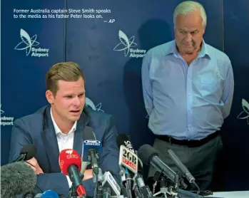  ?? — AP ?? Former Australia captain Steve Smith speaks to the media as his father Peter looks on.