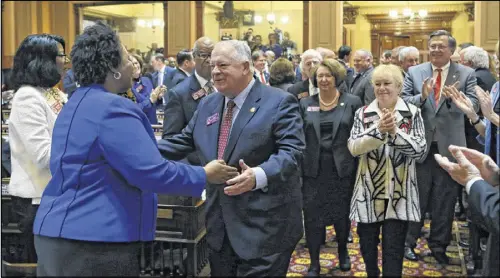  ?? BOB ANDRES /BANDRES@AJC.COM ?? State Rep. David Ralston, R-Blue Ridge, is congratula­ted by House Minority Leader Stacey Abrams, D-Atlanta, after he was re-elected speaker of the Georgia House on Monday as lawmakers returned to Atlanta for a new 40-day session.