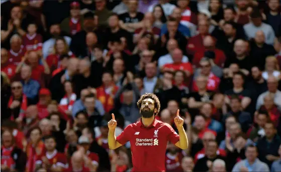  ?? FOTO: LEHTIKUVA/PAUL ELLIS ?? Liverpools Egyptiska mittfältar­e Mohamed Salah firar efter att ha satt bollen i mål i Premier League-matchen mot Brighton.