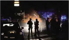  ??  ?? NAVOLATO, Mexico: This photo taken on Feb 07, 2017 shows members of the Mexican army and federal police patrol at a crime scene after an organized crime shooting in the Villa Juarez neighborho­od in this city in Sinaloa. — AFP