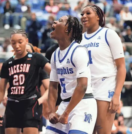  ?? CHRIS DAY/THE COMMERCIAL APPEAL ?? Memphis’ Emani Jefferson celebrates after scoring during the WNIT first round game against Jackson State in the Elma Roane Field House at the University of Memphis on Thursday.