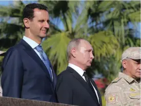  ?? KLIMENTYEV
FOTO: AP-MIKHAIL ?? Syriens president Bashar al-Assad med sin allierade, Rysslands president Vladimir Putin och Rysslands försvarsmi­nister Sergej Shoigu.