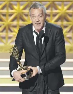  ?? KEVIN WINTER/GETTY IMAGES ?? Montreal’s Jean-Marc Vallée accepts the Emmy for outstandin­g directing for a limited series, movie, or dramatic special for Big Little Lies.