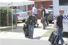  ?? — Reuters ?? Victorian Police conduct a search of a house in Werribee in the Western suburbs of Melbourne in relation to the arrest of a man suspected of plotting an attack on New Year’s Eve on Tuesday.